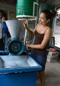 2015 - Mangle participant demonstrates corn grinder