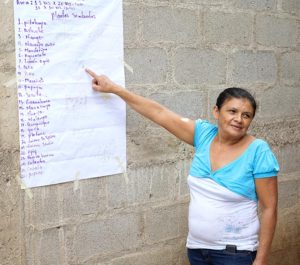 2016 - ODESAR participant shows the list of vegetables that she has grown